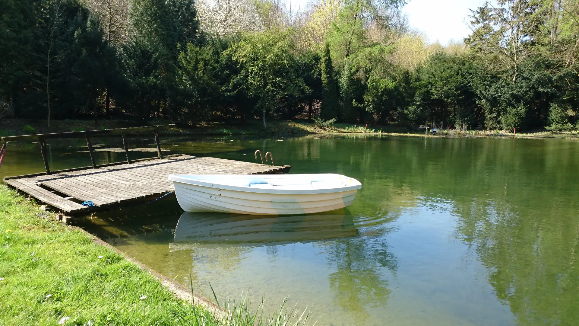 Rowing boat at the jetty on the mill pond