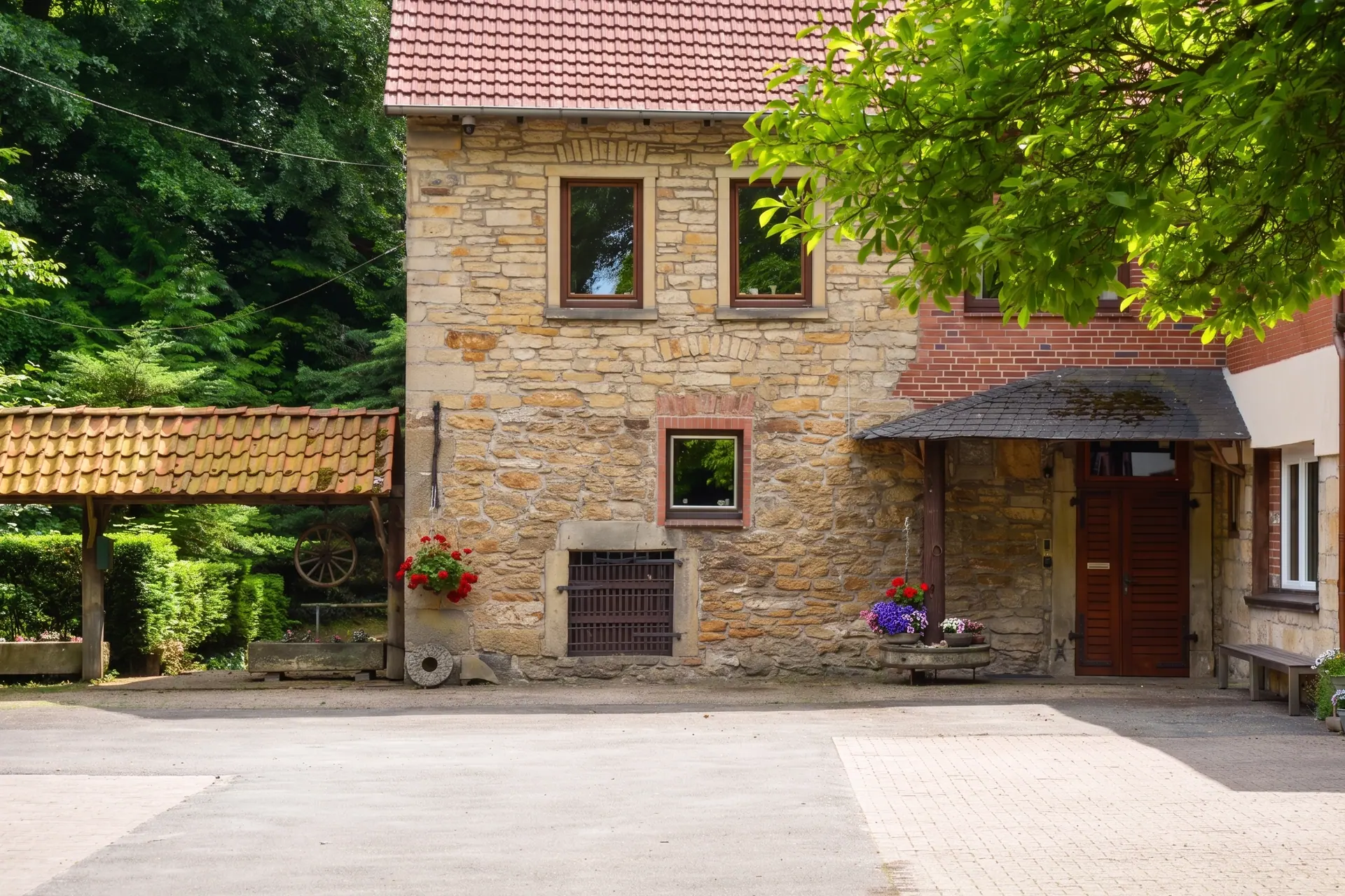 The mill yard today with the rubble-stone and half-timbered mill house